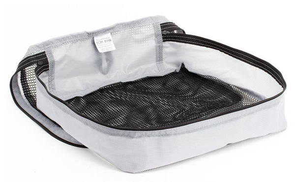An empty and open Northwest Sky (light grey) Aether Large Aeronaut 30 Packing Cube.